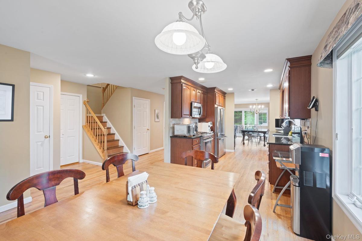 Breakfast Room Looking into Kitchen and stairway to 2nd Floor