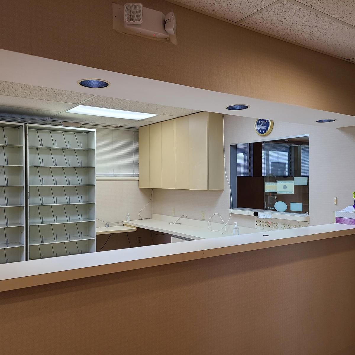 Kitchen featuring open shelves, light countertops, and a paneled ceiling