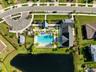 Resort style community clubhouse with a community pool, fitness center and lake front pool.