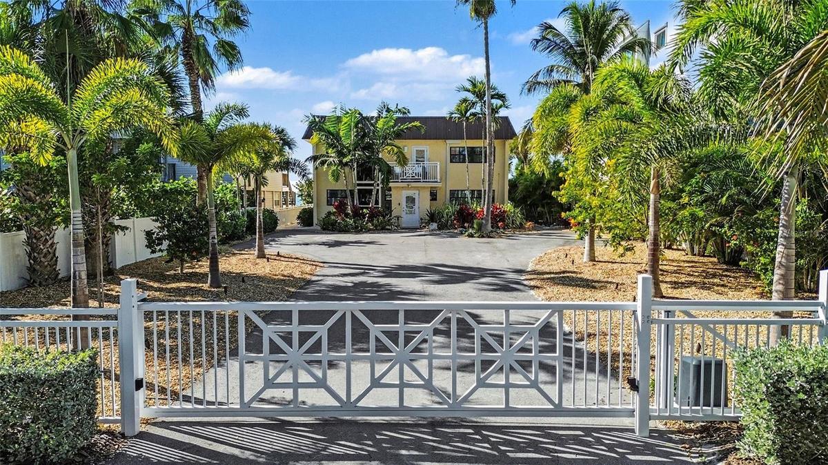 Enter your beachfront property through a custom remote gate, offering further privacy.