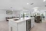 Breakfast bar island with wet bar and beverage fridge