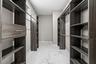 Custom walk in closet designed for exceptional storage