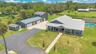 Aerial View of ADU, 6 car garage, Workshop (2 car space) and 2/1 guest unit with a loft and kitchenBrand new Hardie Board siding on ADU, metal roof o
