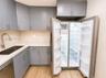 SPACIOUS CUSTOM DESIGNED QUARTZ COUNTER AND CUSTOM FINISHED CABINET SYSTEMS
