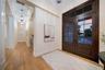 Double door entry with elegant hallway on both sides