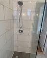 Full bath featuring a shower stall