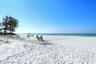 The cool quartz sands of the Whispering Sands private beach.