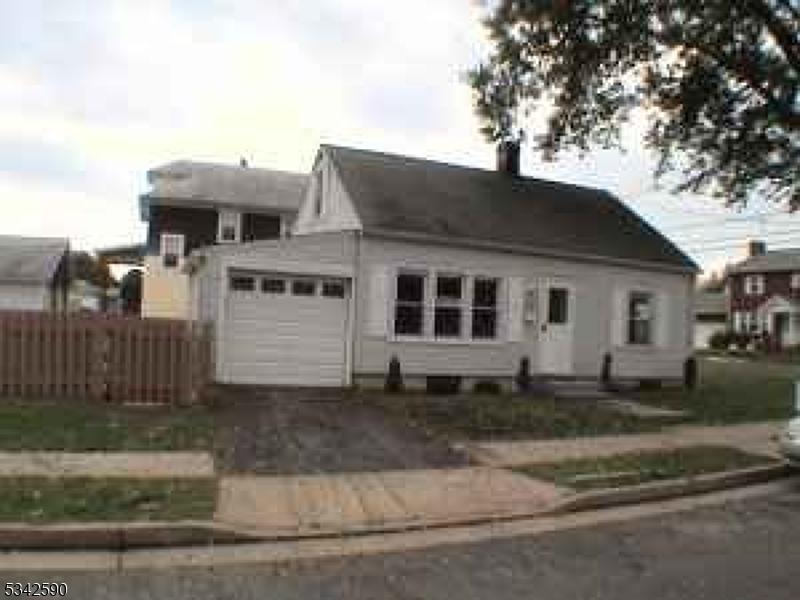 Front of home, fenced in yard.