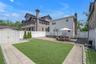 Spacious backyard with the pvs white fence all around house