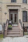 Doorway to property with brick siding