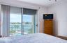 Primary bedroom with access to balcony and view