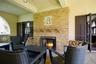 Outdoor patio with glazed ceramic and fireplace