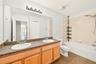 Upstairs bathroom featuring a dual sink vanity
