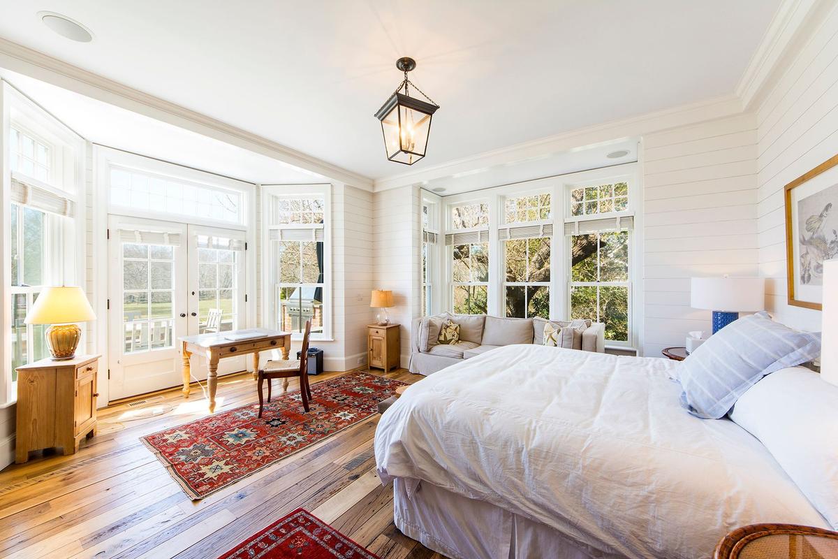 First Floor Master Bedroom with with French doors to bluestone terrace and pool