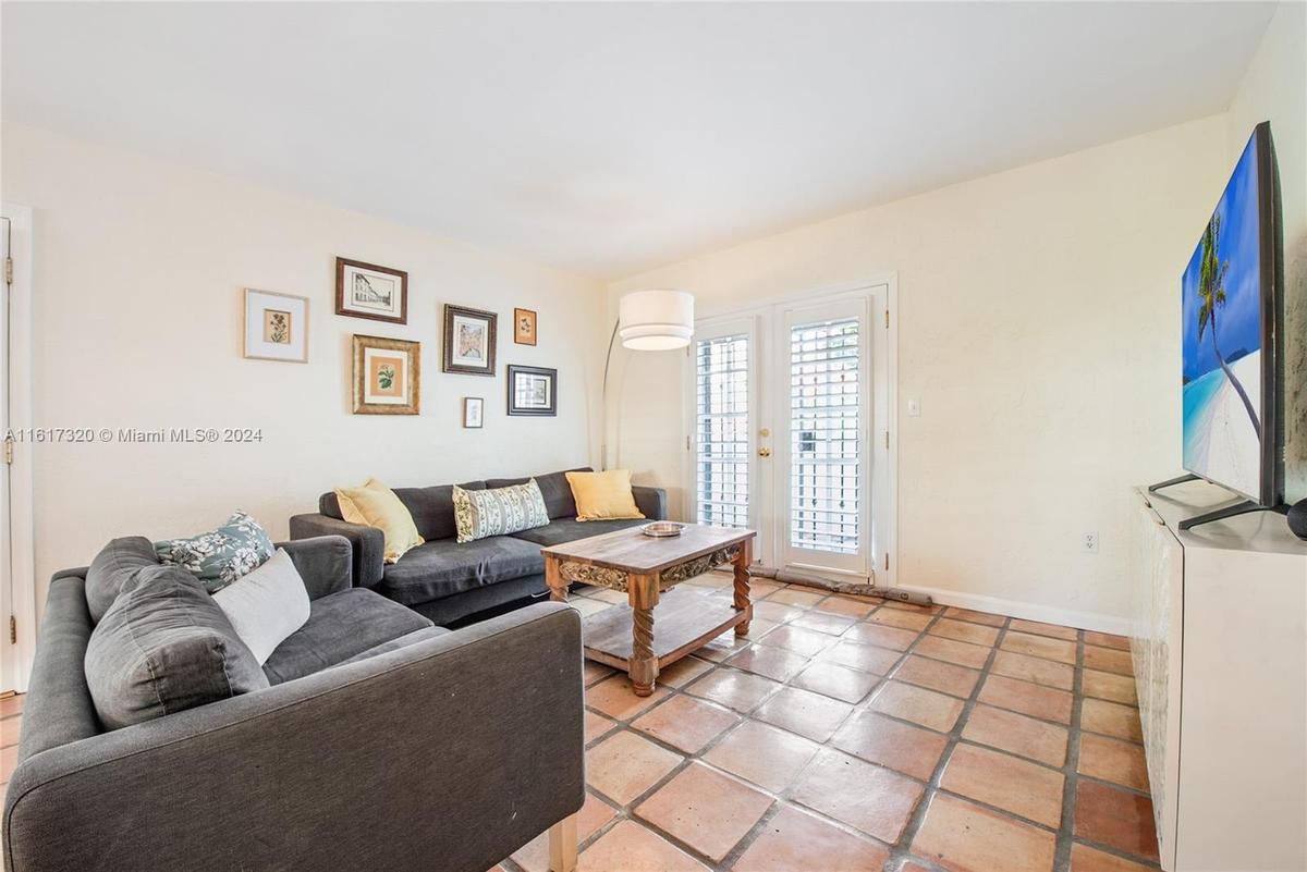 Interactive luminous and quiet living room and dining room area with access downstairs patio.