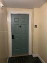 Unit entry in corner outside of elevator