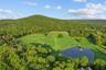 Land featuring large pond with gazebo. Approximately 20 of the 38 acres are contained with cedar, split rail fencing - all newly re-fenced in 2021.