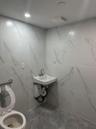 Bathroom featuring sink and toilet