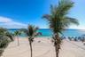 Direct beach access and panoramic ocean views throughout the unit.