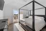 Bedroom with multiple windows, hardwood / wood-style floors, access to exterior, and ceiling fan