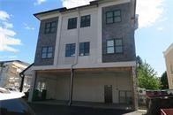 Rear view of house with a garage