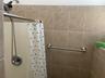 Bathroom featuring curtained shower
