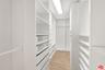 Large walk-in closet of primar