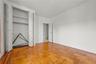Unfurnished bedroom with a closet and baseboards