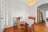 Dining room with arched walkways and a chandelier