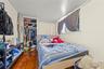 Bedroom featuring a closet and wood-type flooring