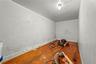 Additional living space featuring wood-type flooring