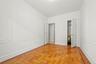 Unfurnished bedroom featuring a closet and baseboards