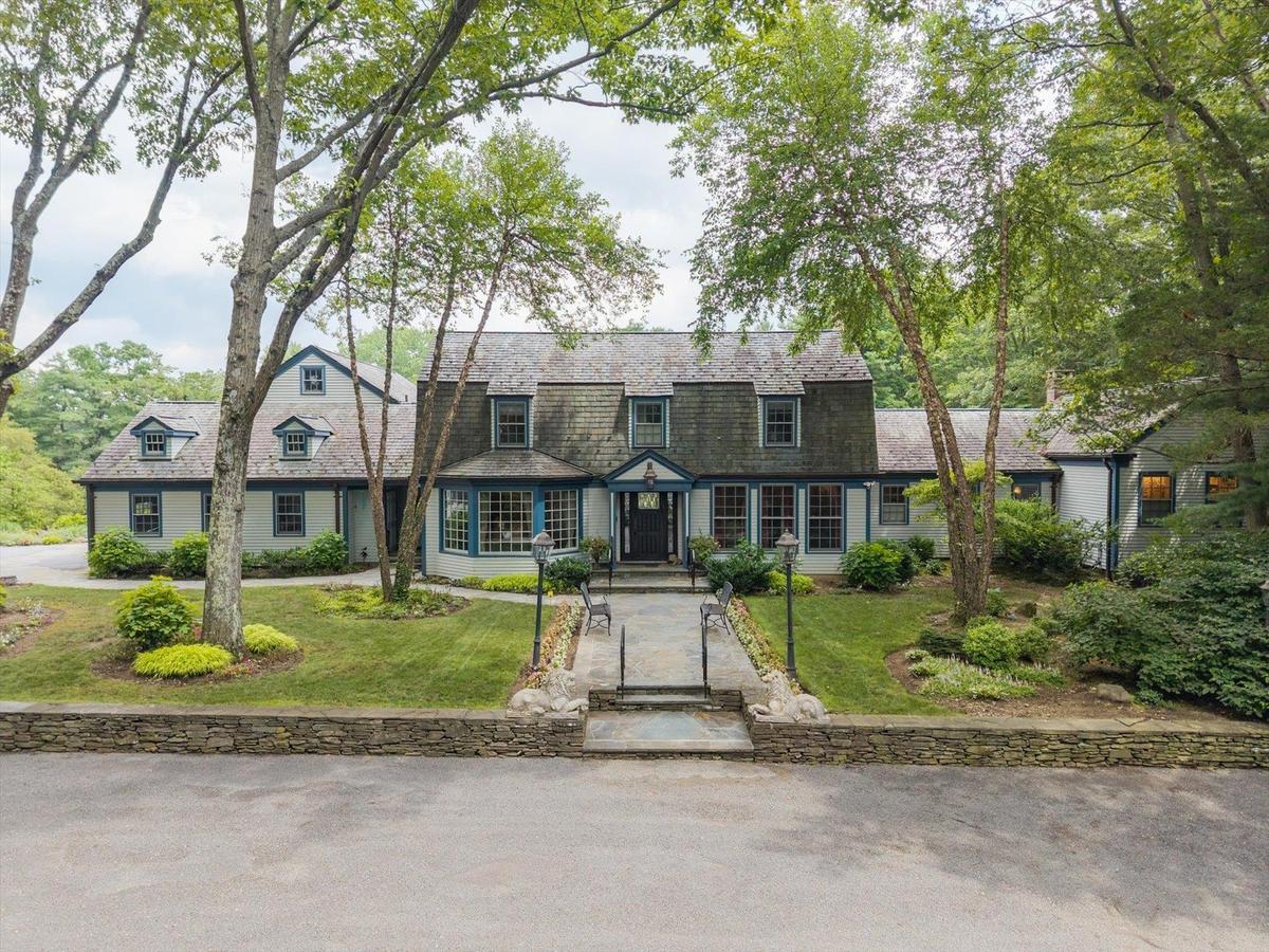Colonial inspired home with a front yard