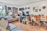 Living room with a textured ceiling and wood finished floors
