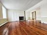 Living Room in Stone House, Natural wood floors & fireplace