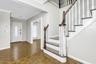 Entryway with baseboards, ornamental molding, stairway, and recessed lighting