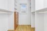 Walk in closet featuring light wood-style flooring