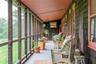Sunroom featuring vaulted ceiling