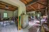 Miscellaneous room with a wood ceiling with exposed beams and light wood-style flooring
