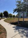 View of home's community featuring a yard