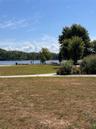 View of green lawn with a water view
