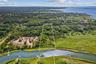 Aerial overview of property's location featuring a large body of water and property boundaries highlighted