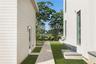 View of green lawn featuring a water view