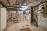 Unfinished basement featuring electric panel
