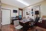 Home office with dark wood finished floors