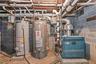 Utility room featuring water heater