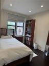 Bedroom featuring dark wood-type flooring and recessed lighting