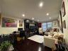 Living area featuring dark wood-type flooring, an office area, recessed lighting, and cooling unit