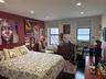 Bedroom featuring hardwood / wood-style flooring, recessed lighting, and cooling unit