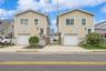 Split level home with a garage and concrete driveway